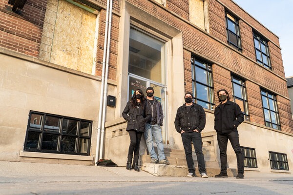 Maggie Maybe and The Music Hall team pose in front of their new building in Oshawa