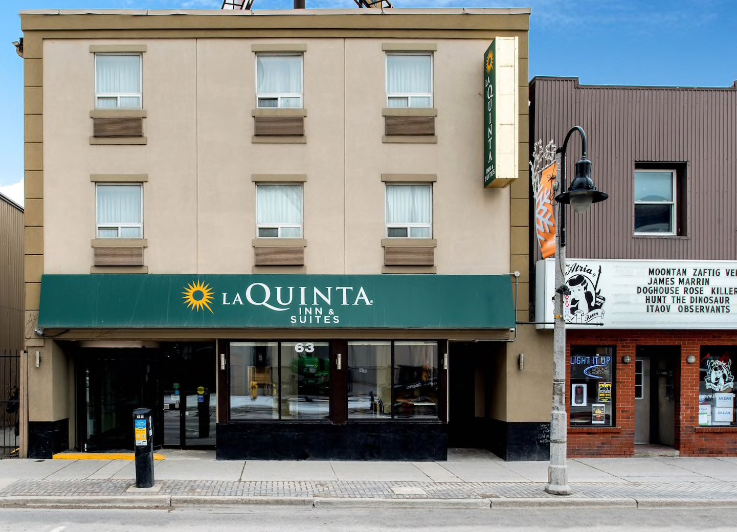 exterior photo of La Quinta Inn & Suites and The Atria Bar and Grill, Oshawa
