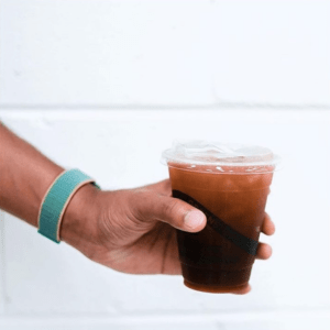 Close up of a cold brew in a person's hand from Roam in Bowmanville.