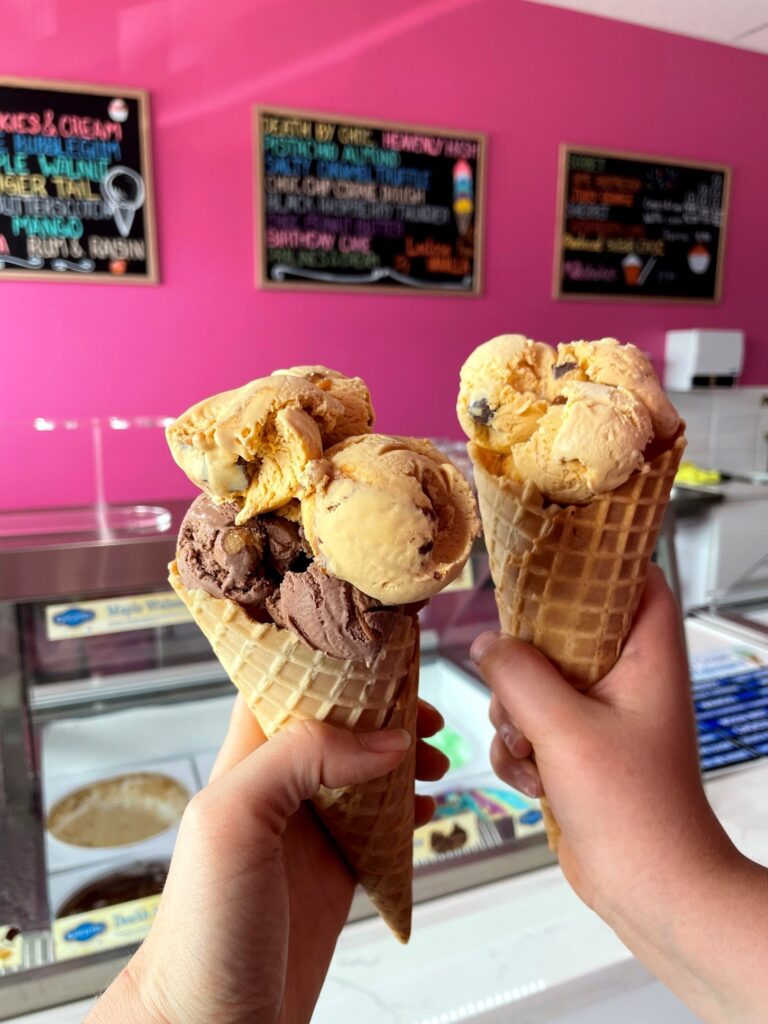 Close up of two huge ice cream cones.
