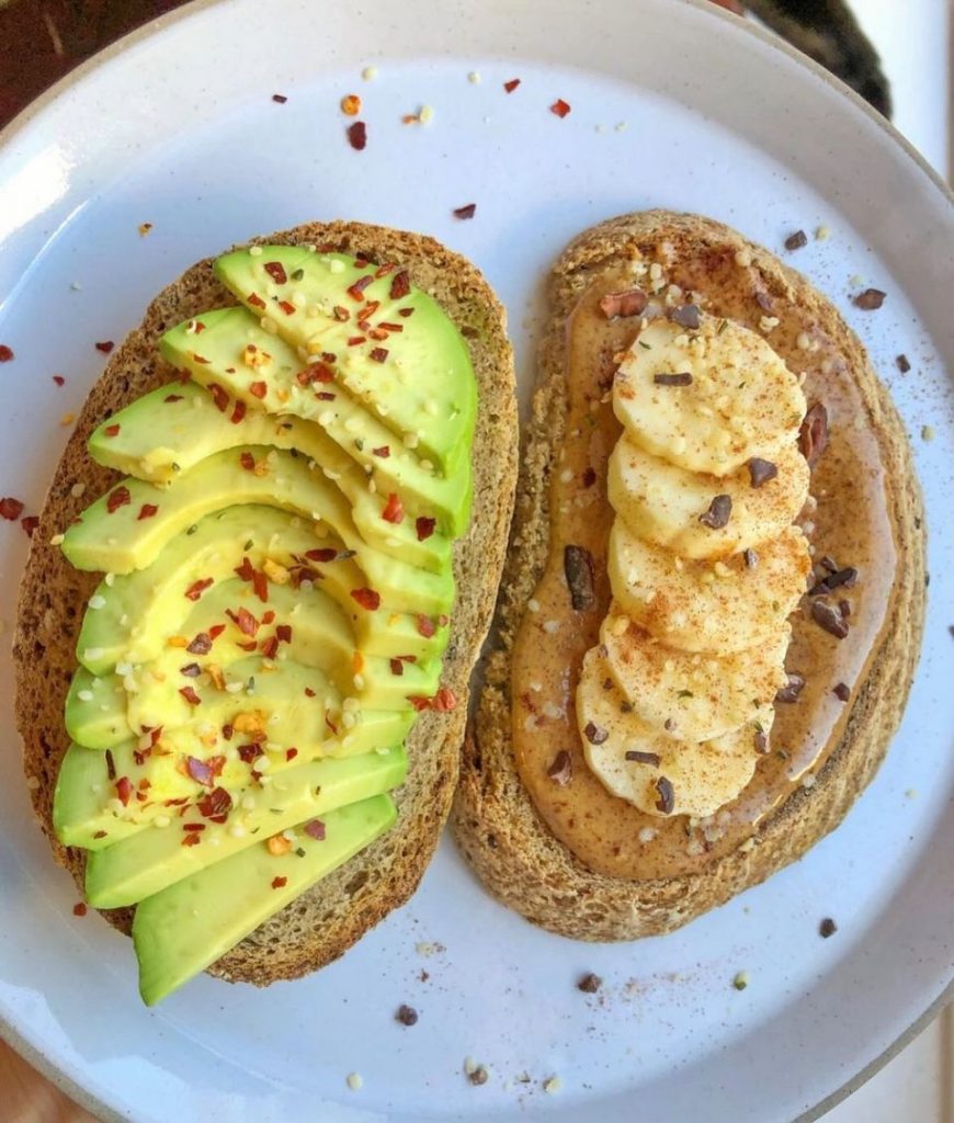 Avocado toast and peanut butter toast with banana slices.