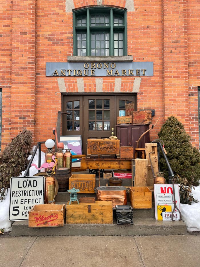 Antiques and vintage home décor staged outside of the Orono Antique Market.