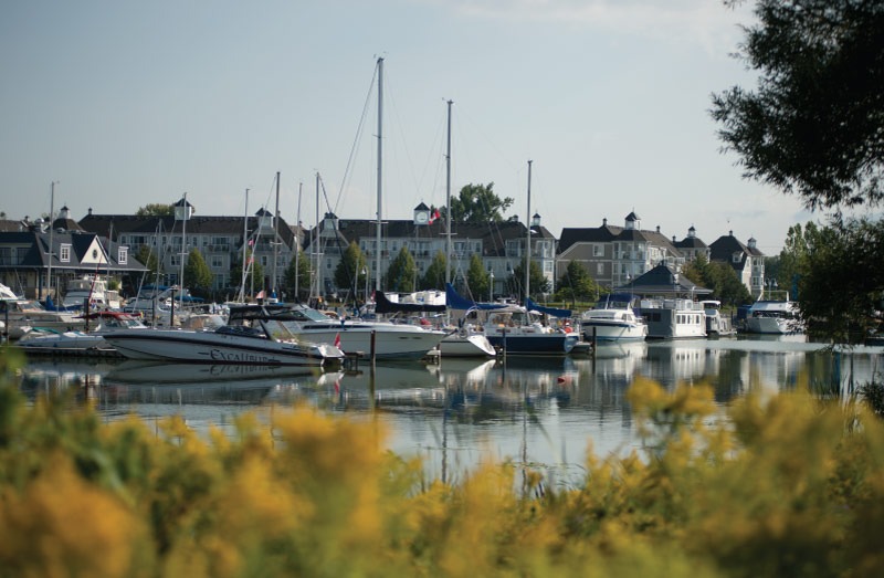 Boats at the marina at Frenchman's Bay with Pickering Nautical Village in the background.