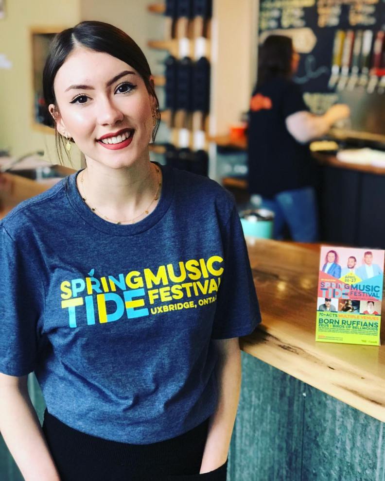 Woman wearing Springtide Music Festival t-shirt