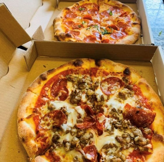 Pizzas in delivery boxes from Corrado's.